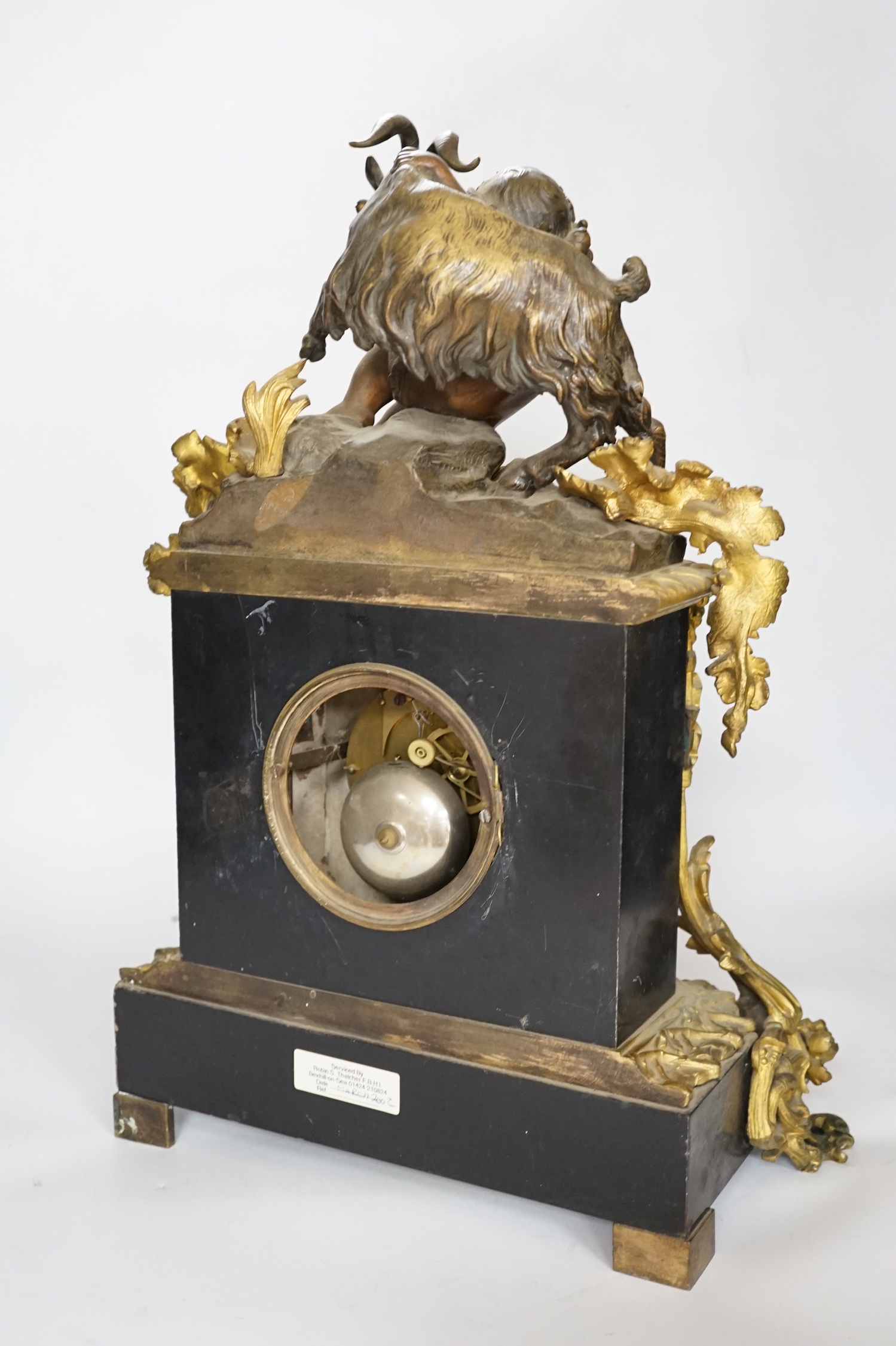 An early 20th century gilt-metal mounted mantel clock with bacchanalian group surmount, 44cm